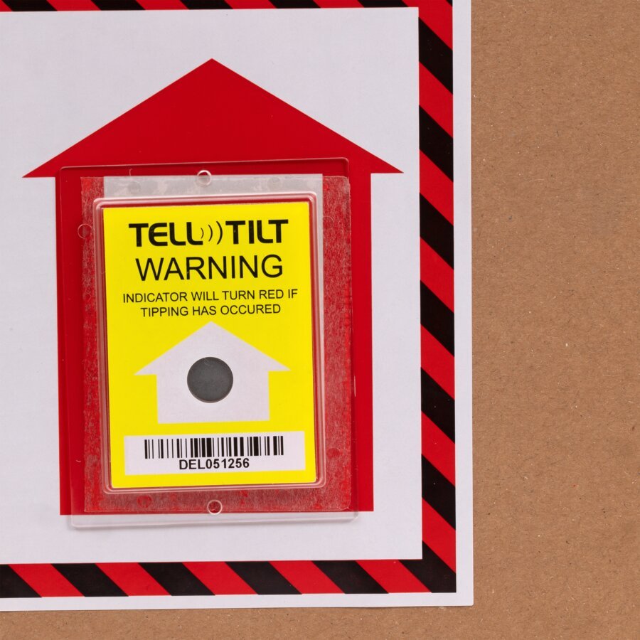 Kippindikator mit Warnhinweis Aufrecht positionieren. Nahaufnahme Kippindikator mit Warnhinweis